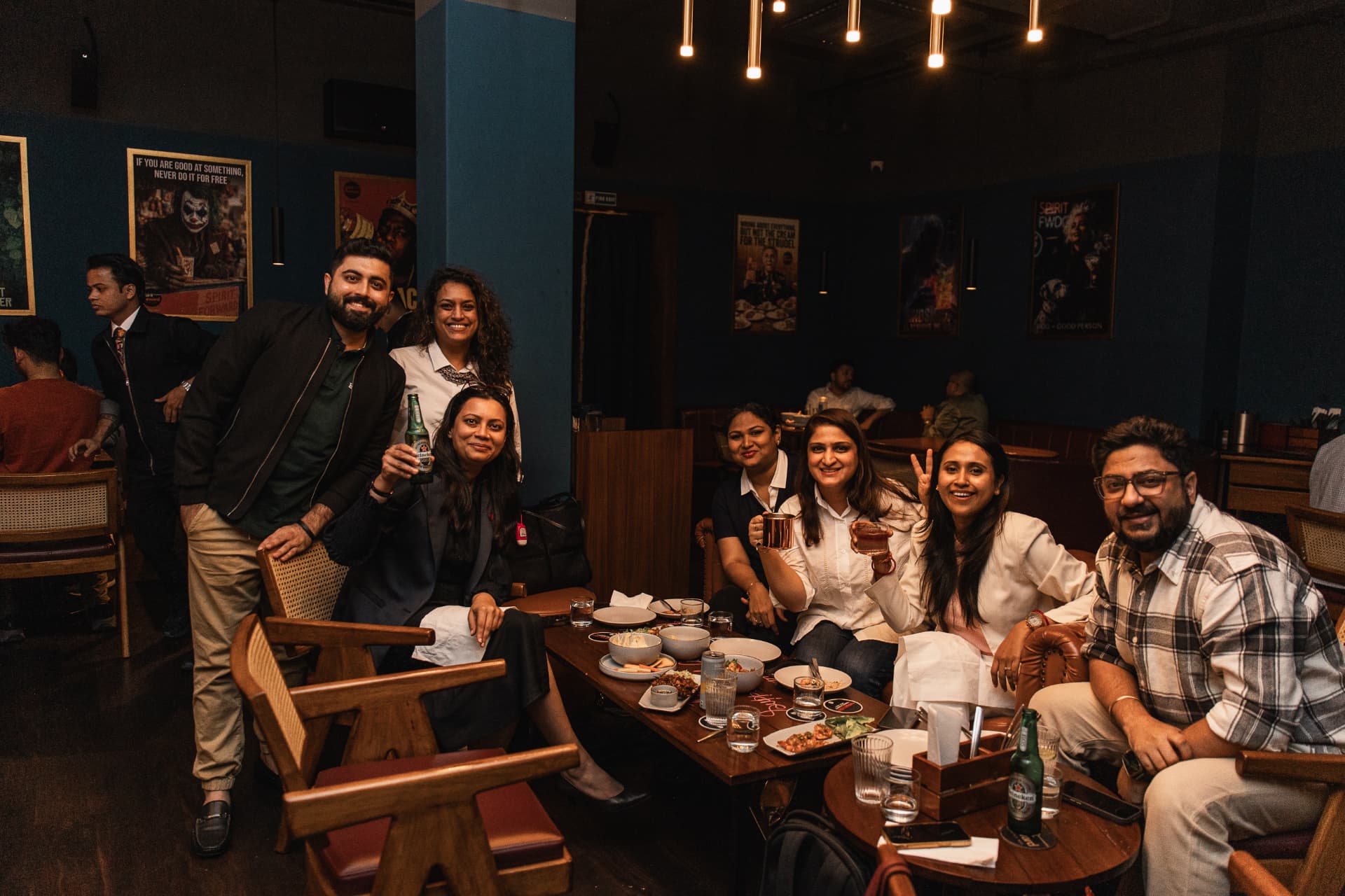 A table of friends toasting in the dining room