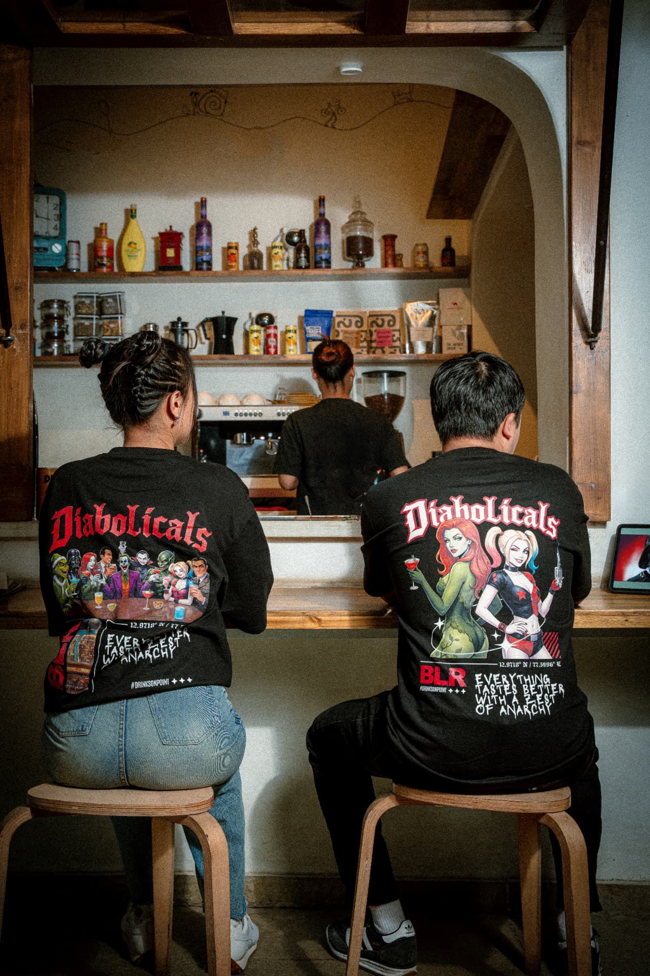 Two Diabolicals tee back prints at the cafe counter