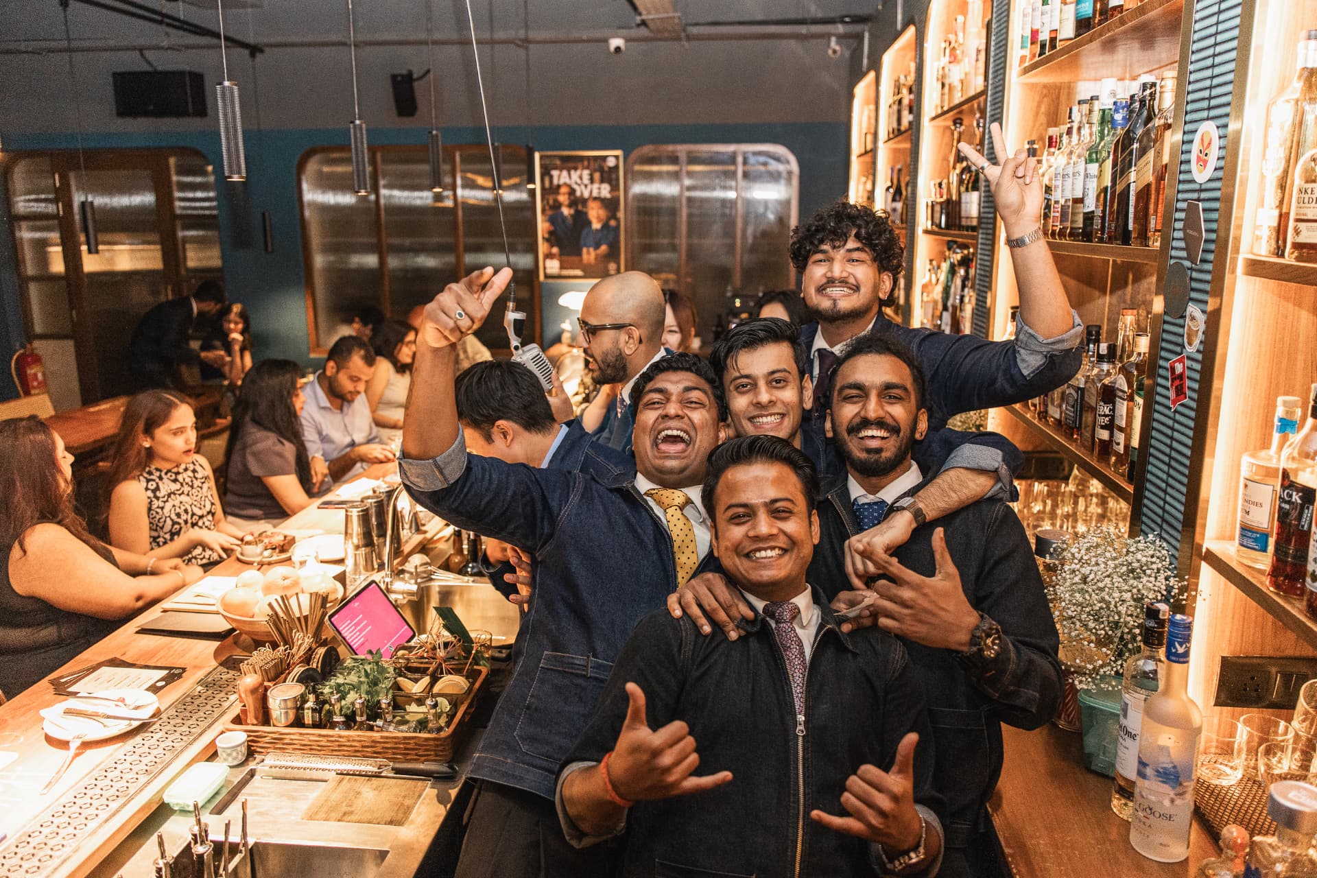 Bar team celebrating behind the counter